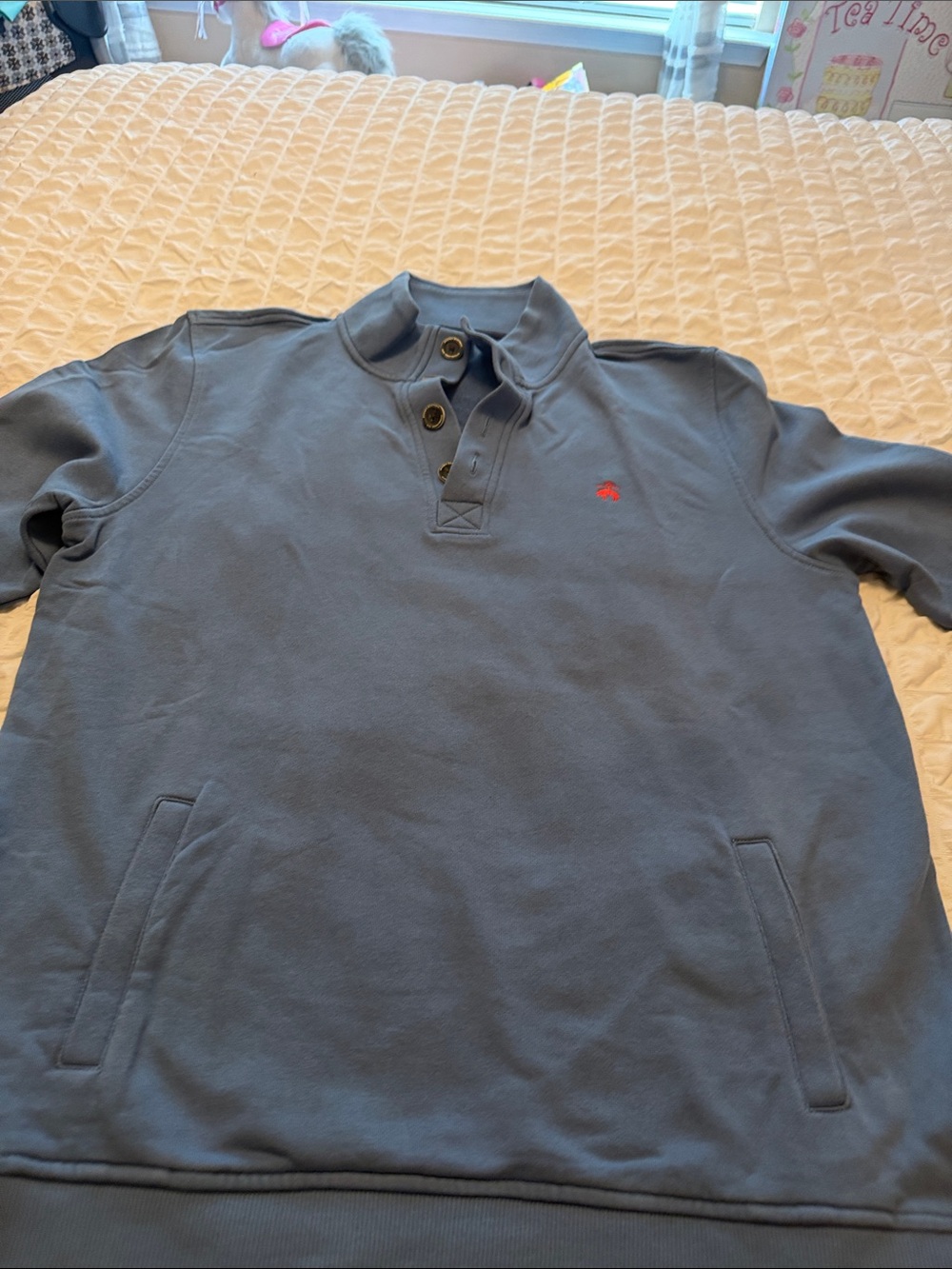 Brooks Brothers light blue sweater with side pockets.